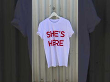 Load and play video in Gallery viewer, SHE'S HERE, T-SHIRT
